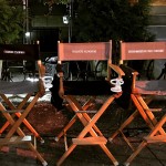 Set chairs with Bruce Willis, Adrian Grenier, and Christopher Rob Bowen.
